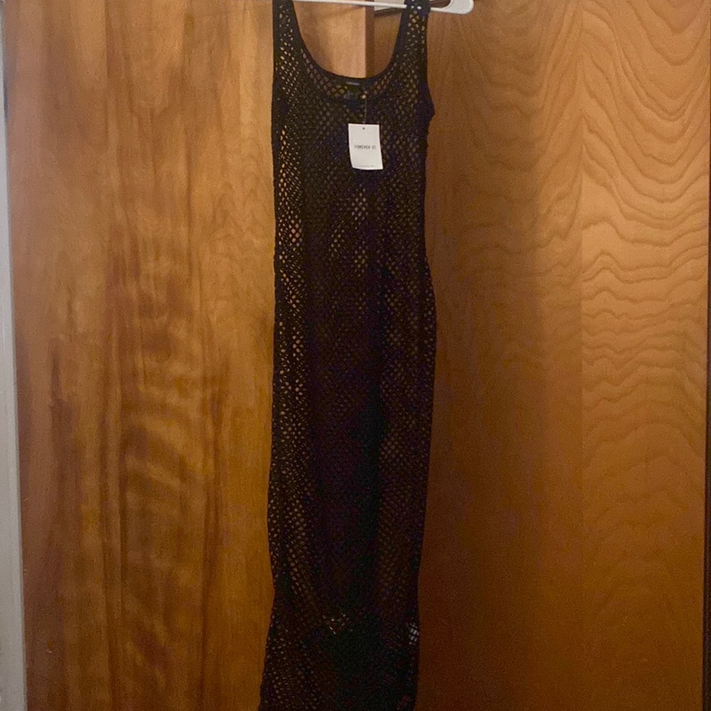 Black netted dress can be worn as a coverup or perfect for a festival!